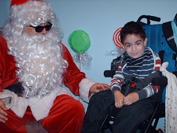 A child posing with Santa